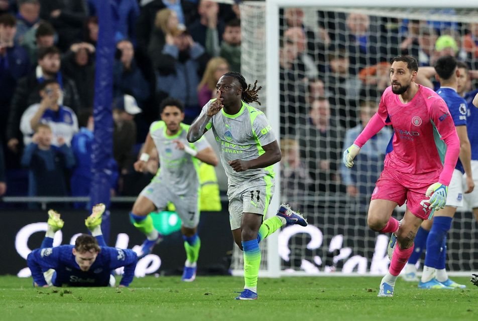 Manchester City's Jeremy Doku celebrates scoring their third goal with Manchester City's Gianluigi Donnarumma. Photo: REUTERS/Scott Heppell