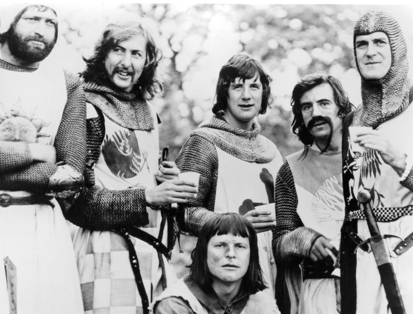 Graham Chapman, Eric Idle, Terry Gilliam, Michael Palin, Terry Jones, and John Cleese in 'Monty Python And The Holy Grail', 1975. Photo: EMI Films/Getty Images
