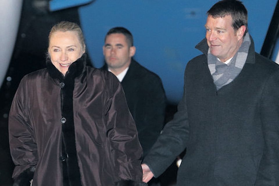 US Secretary of State Hillary Clinton is greeted at Dublin Airport by the charge d'affaires of the US Embassy, John Hennessey Niland