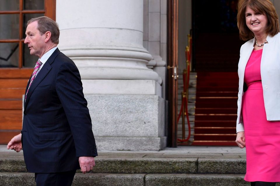 Ireland's Taoiseach Enda Kenny and Tanaiste Joan Burton depart Government Buildings after announcing the beginning of the General Election in Dublin. Photo: Reuters/Clodagh Kilcoyne