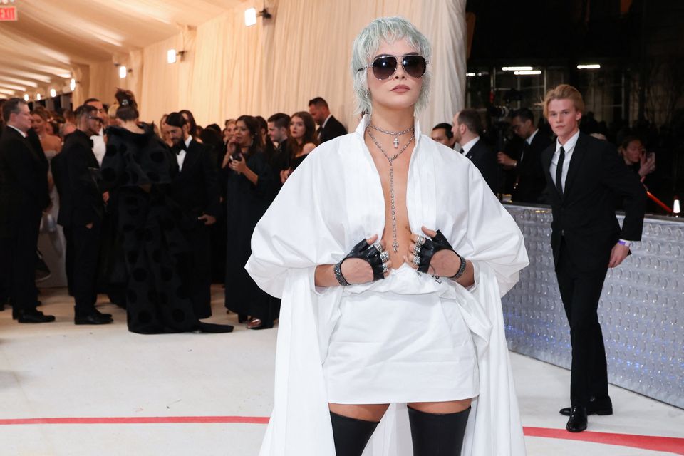 Cara Delevingne poses at the Met Gala, an annual fundraising gala held for the benefit of the Metropolitan Museum of Art's Costume Institute with this year's theme "Karl Lagerfeld: A Line of Beauty", in New York City, New York, U.S., May 1, 2023. REUTERS/Andrew Kelly