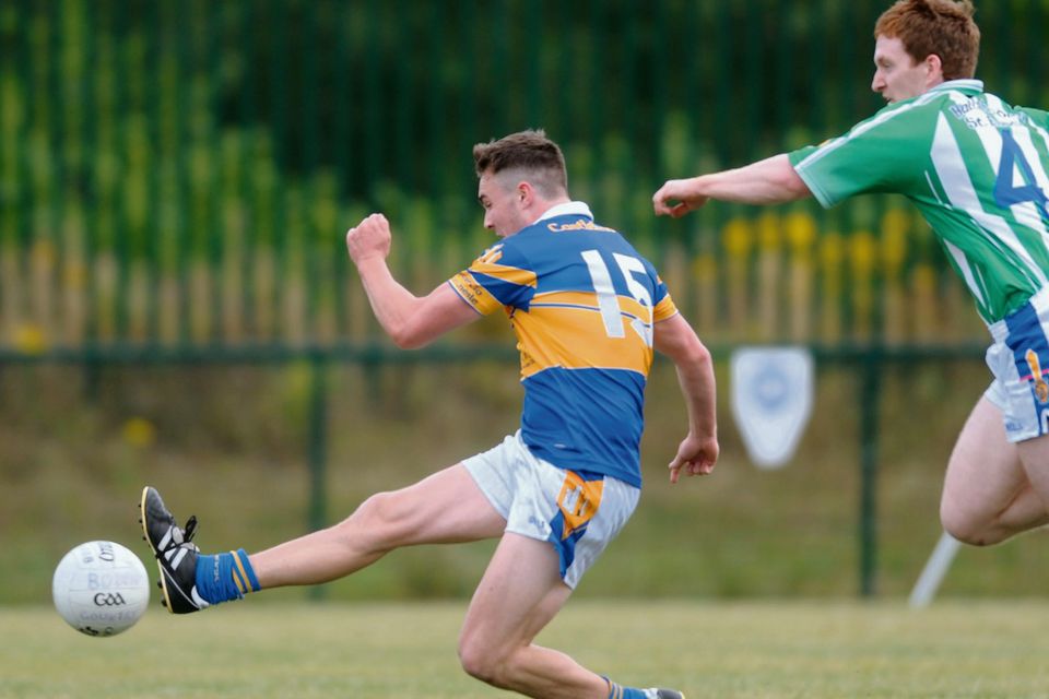 Castlenock's Kevin Kindlon kicks a goal despite defence from Sean Cantwell, Ballyboden St Enda's. Picture: Caroline Quinn