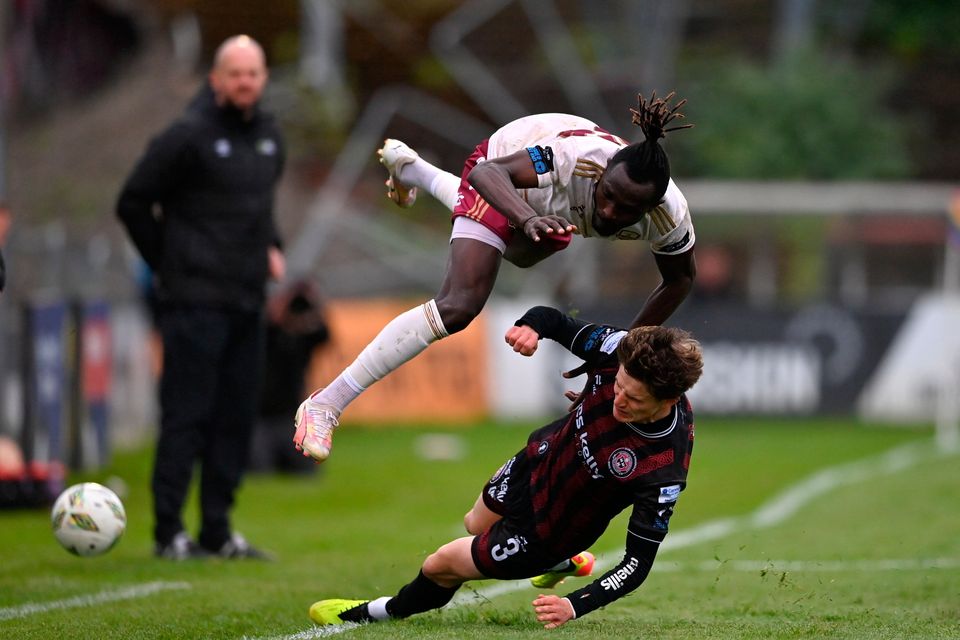 Jeanno Esua of Galway United is tackled by Paddy Kirk of Bohemians during the SSE Airtricity Premier Division match at Dalymount Park in Dublin. Photo: Ben McShane/Sportsfile