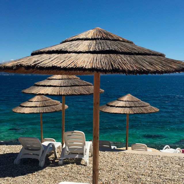 You can rent a lounger and straw umbrella on Lanterna beach