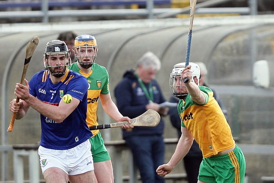 Wicklow's Andrew Kavanagh looks to fire this ball forward as Donegal's Ronan McDermott tries to block.