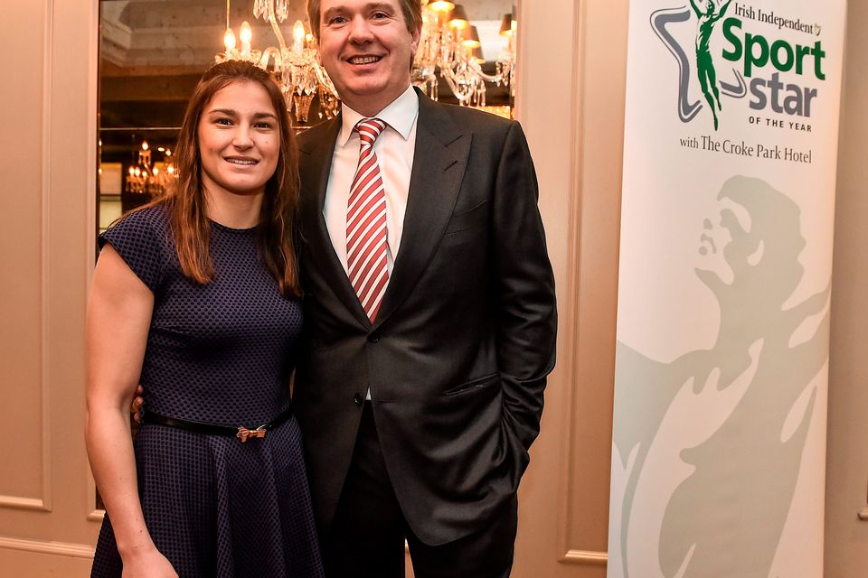 22 December 2014; Stephen Rae, Editor of the Irish Independent with Katie Taylor, during the Croke Park Hotel / Irish Independent Sportstar of the Year Luncheon 2014. The Westbury Hotel, Dublin. Picture credit: David Maher / SPORTSFILE
