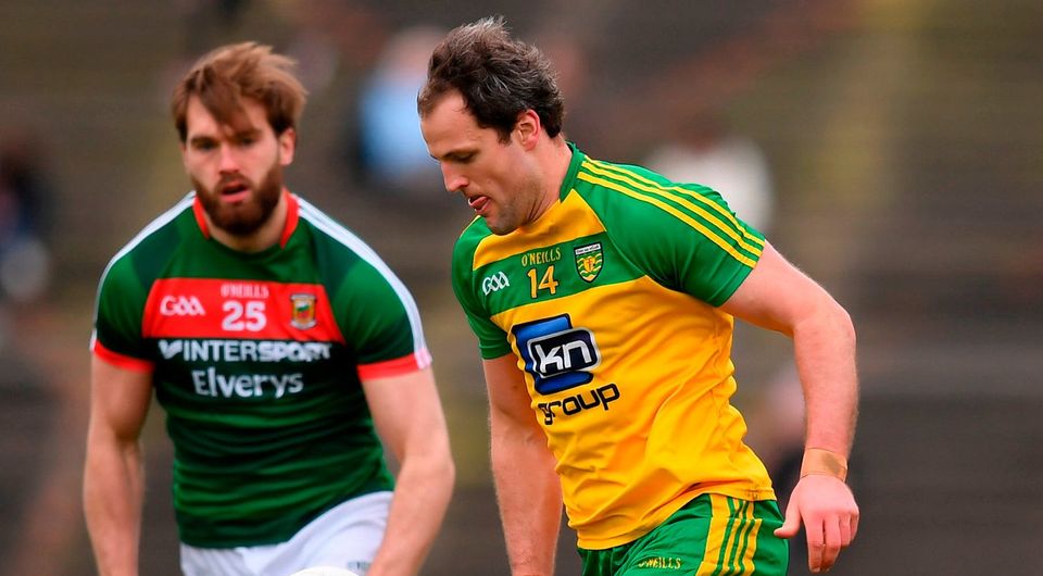 Donegal's Michael Murphy in action against Mayo's Aidan O'Shea. Photo: Stephen McCarthy/Sportsfile