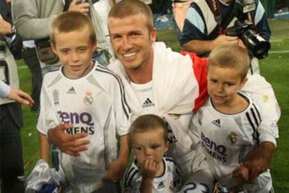 David Beckham with sons Romeo, Brooklyn and Cruz. In 2011, Victoria Beckham gave birth to the couple's first daughter, named Harper Seven.