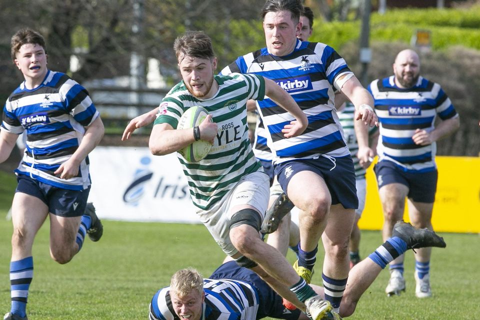Conor McAleer escapes the clutches of the Corinthians defence.