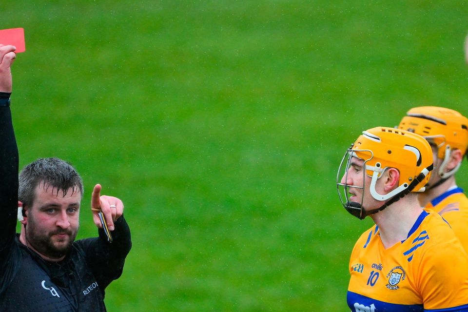 Referee Thomas Walsh shows a red card to Clare's David Fitzgerald at Cusack Park in Ennis. Photo: Ray McManus/Sportsfile