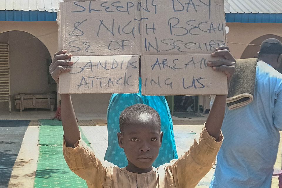 A boy protests against the kidnapping of hundreds of school pupils by gunmen. Photo: Reuters