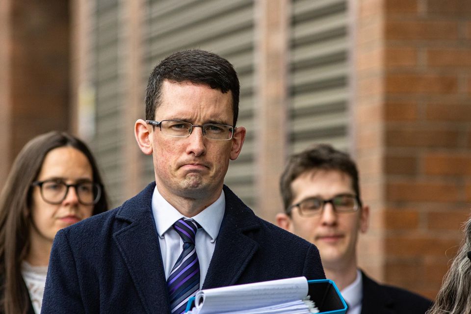 Enoch Burke and his family at the High Court yesterday. Photo: Mark Condren