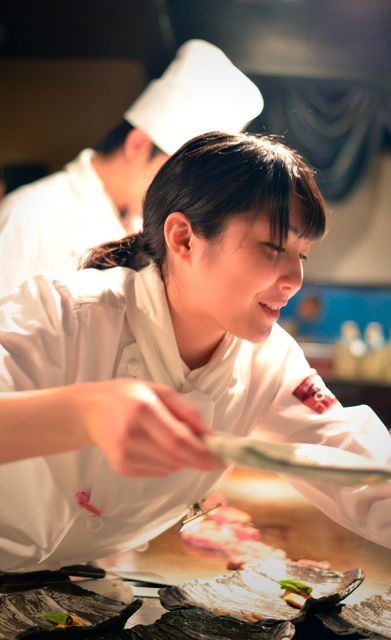 Chefs serve up the courses at Presdient chibo, Osaka.