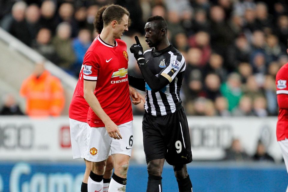 Papiss Cisse, right, has apologised over the incident with Jonny Evans during Newcastle's defeat against Manchester United