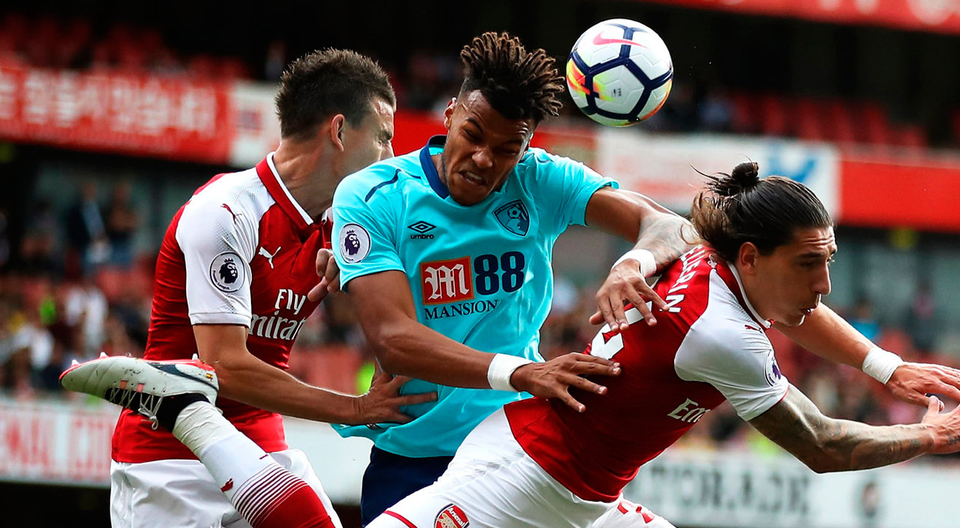 Tyrone Mings of AFC Bournemouth and Hector Bellerin of Arsenal battle for possession in the air. Photo: Getty Images