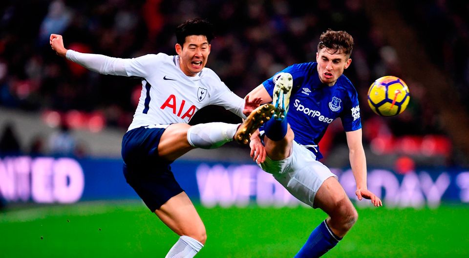 Jonjoe Kenny of Everton chalenges Son Heung-Min of Tottenham Hotspur    Photo: Getty