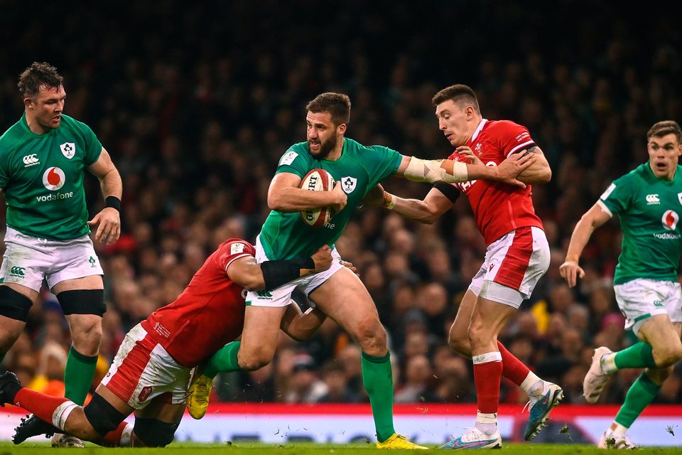 Stuart McCloskey of Ireland is tackled by Taulupe Faletau, 12, and Josh Adams, right, of Wales during the Six Nations clash in Cardiff, Wales. Photo by David Fitzgerald/Sportsfile