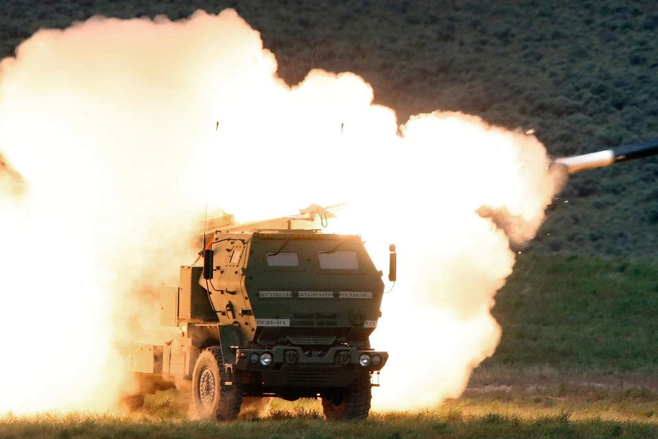 A launch truck fires the High Mobility Artillery Rocket System (Himars) during combat training in the US. Photo: Tony Overman/Via AP