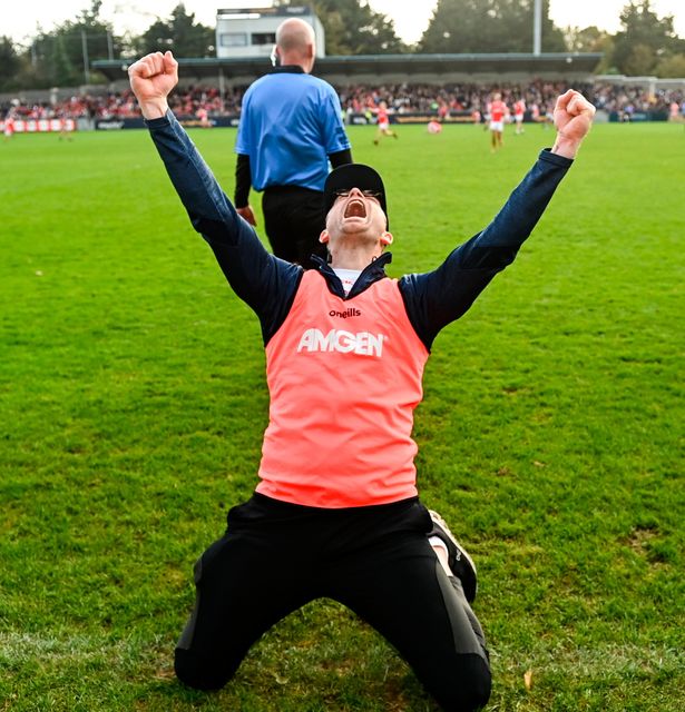 Cuala manager Austin O'Malley celebrates after the game