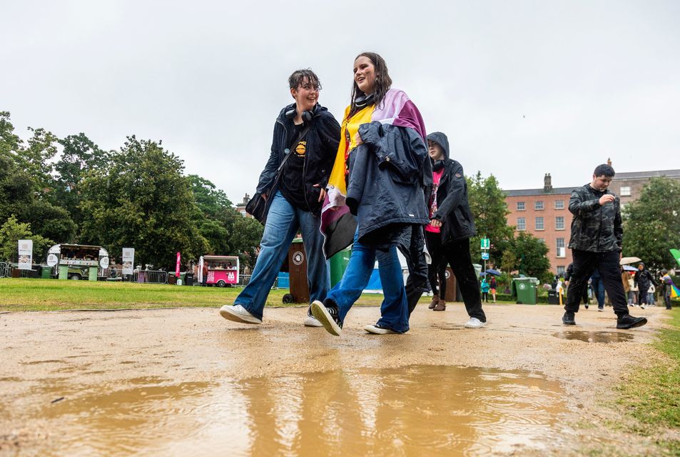 People brave the conditions as they take part in Dublin Pride events.  Photo: Evan Treacy/PA Wire