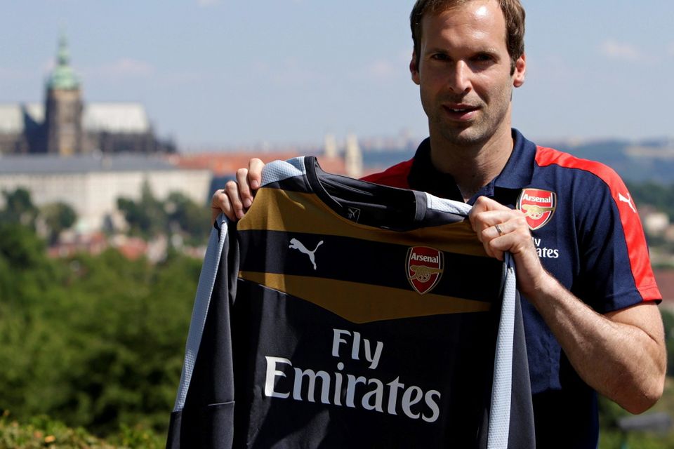 Czech soccer player Petr Cech shows his Arsenal jersey during a presentation in Prague