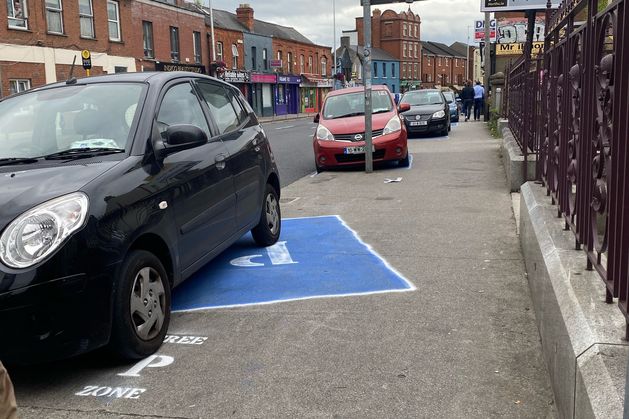 Cyclists paint fake spaces to highlight illegal parking issues in Phibsboro