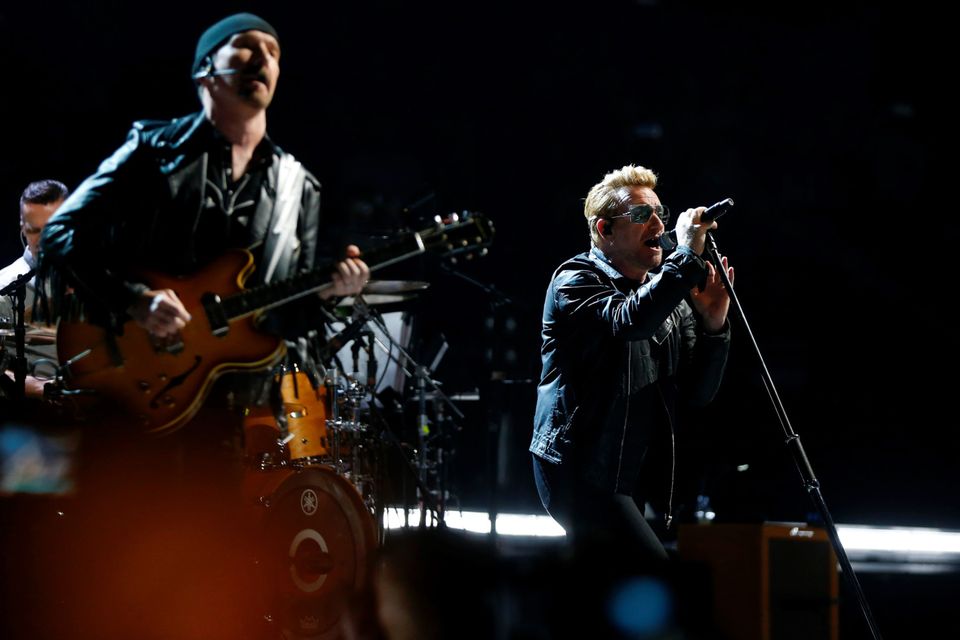 Irish band U2 singer Bono (R) and guitarist The Edge (L)perform on stage at the Bercy Accordhotels Arena in Paris on December 6, 2015.  / AFP / THOMAS SAMSONTHOMAS SAMSON/AFP/Getty Images