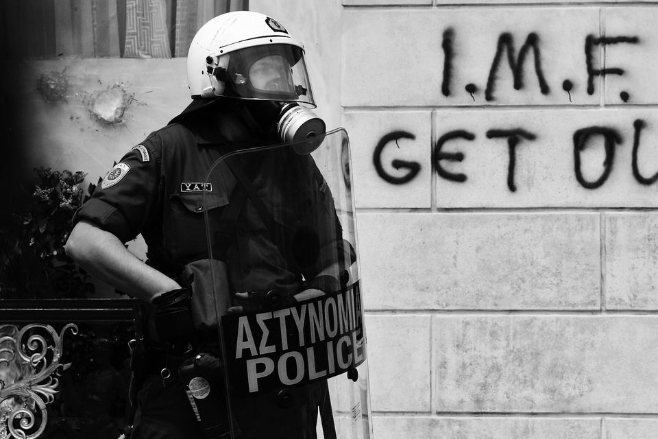 PROTEST: A riot policeman on duty during demonstrations over austerity measures in Athens in 2010