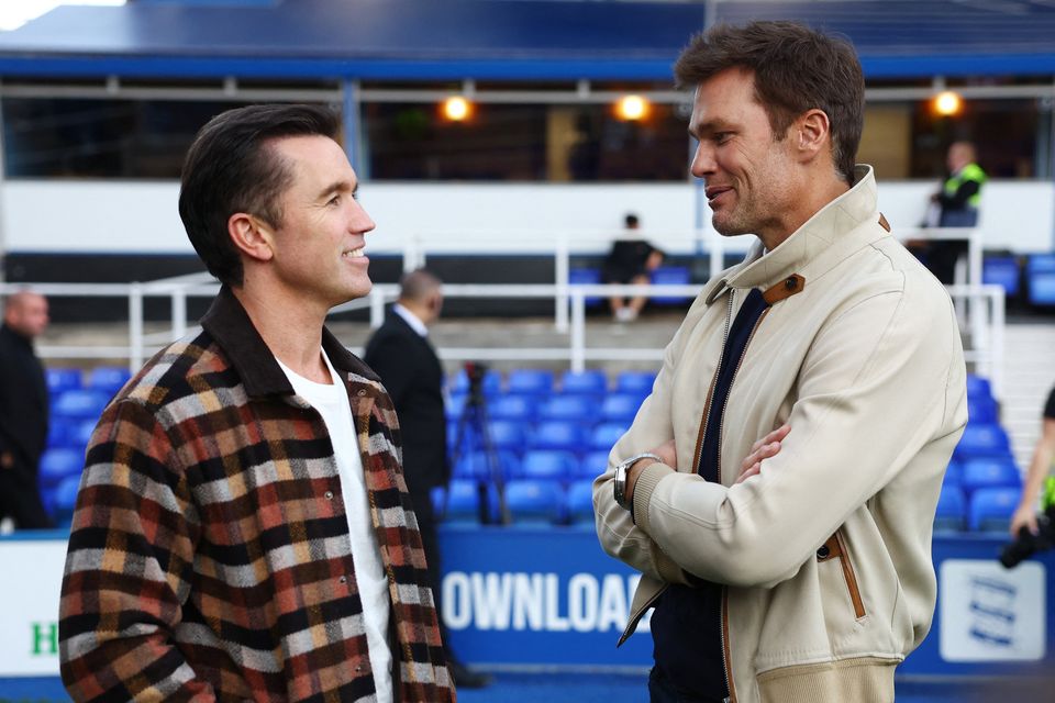 Actor and Wrexham co owner Rob McElhenney and Tom Brady are seen before the match