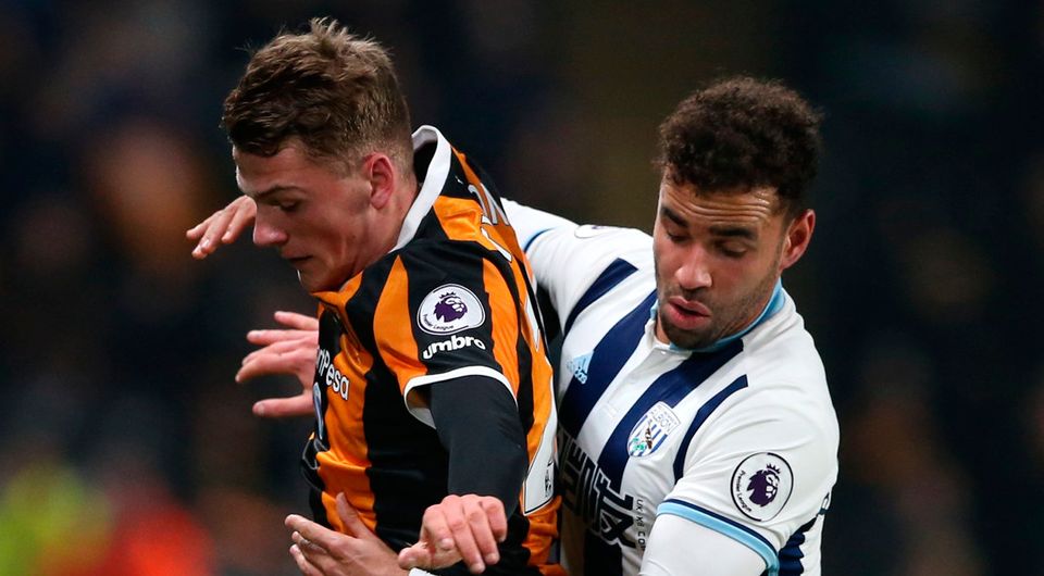 Hull City's Josh Tymon tussels with West Bromwich Albion's Hal Robson-Kanu during the match at The Kingston Communications Stadium. Photo: Scott Heppell/Reuters