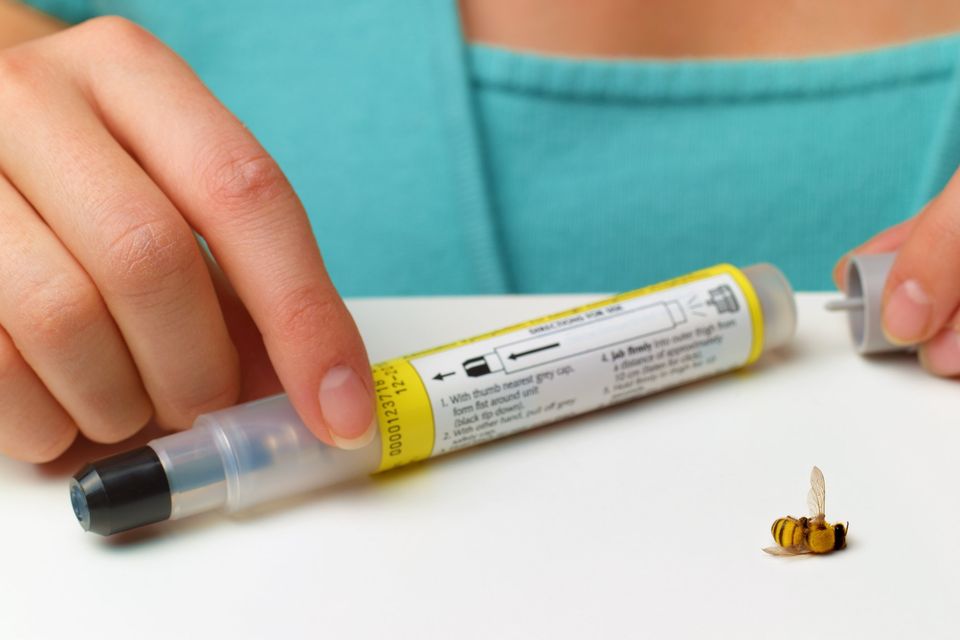 Preparing an EpiPen for use. Photo: Getty