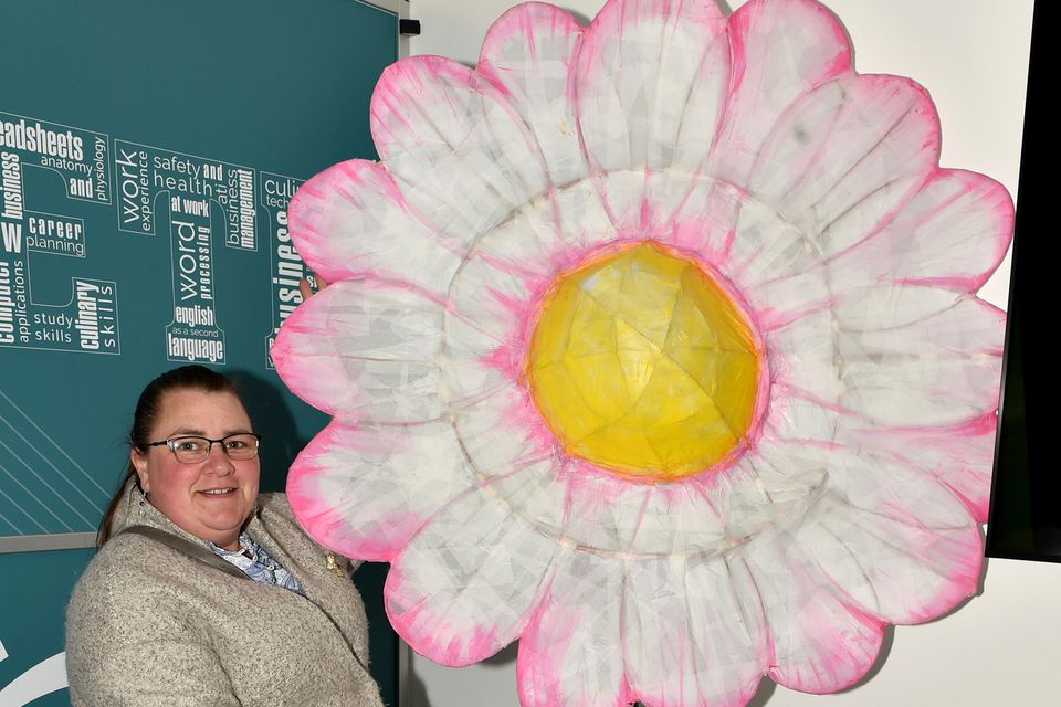 Dawn Tomkins with her work 'The Flower' at the opening of the art exhibition entitled 'Lightening up our everyday learning spaces' as part of the AONTAS Adult Learner Festival in the Gorey Institute of Further Learning and Training Centre on Thursday. Pic: Jim Campbell