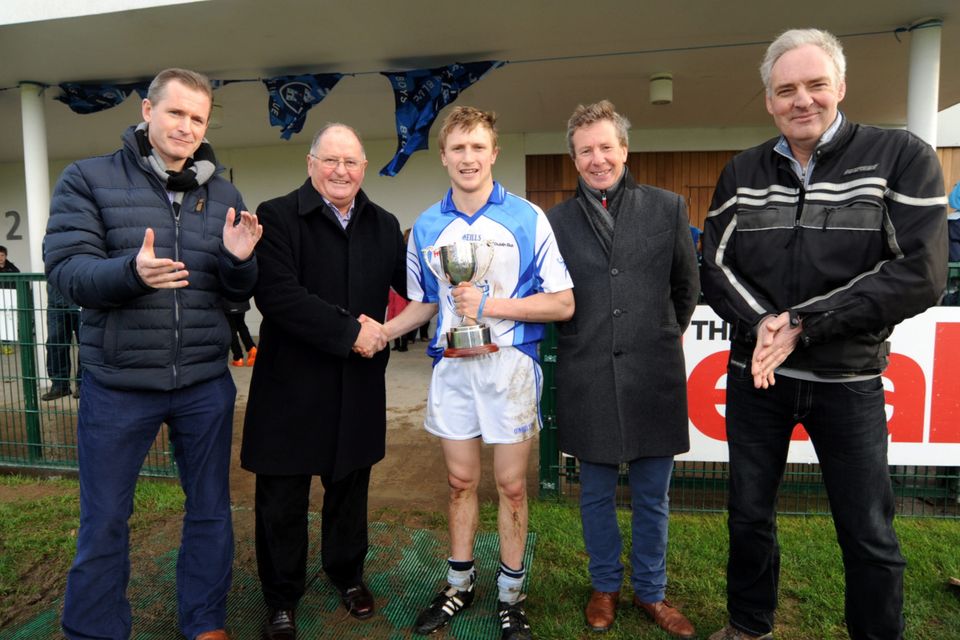 Sean Shanley, Acting Chairman of Dublin County Board, presents cup to Dub Stars Dillion Mulligan, with Julian Drury Byrne, left, Deputy Marketing Director - The Herald, Mark Kelly, 2nd from right, Dublin Bus, and Pat Keane, right, Herald Sports Editor.  Dublin v Dublin Bus/Herald Dub Stars Hurling challenge. Parnells GAA Club, Coolock, Dublin. Picture: Caroline Quinn