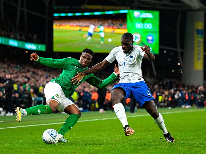 Ireland's Chiedozie Ogbene in action against France's Dayot Upamecano. Photo by: Stephen McCarthy/Sportsfile