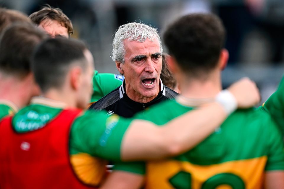 Donegal manager Jim McGuinness talks to his players before the game against Mayo. Photo: Seb Daly/Sportsfile