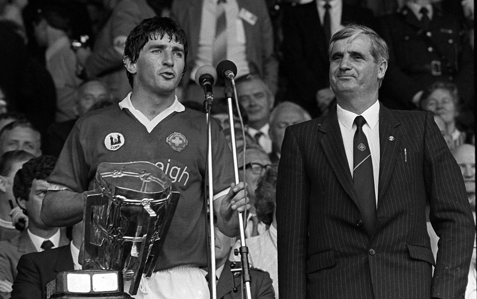 Cork Captain John Fenton lifts the Liam MacCarthy after the 1984 All-Ireland hurling final against Offaly. Also pictured is the then GAA President Paddy Buggy