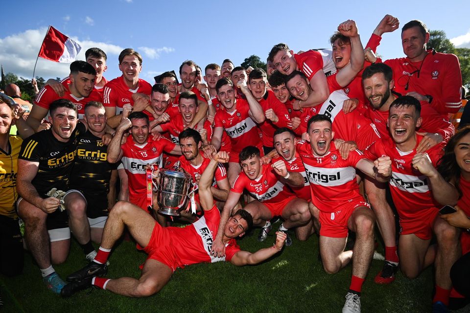 Derry players celebrate with the Anglo-Celt Cup after their Ulster SFC final success against Donegal in 2022. Photo: Stephen McCarthy/Sportsfile