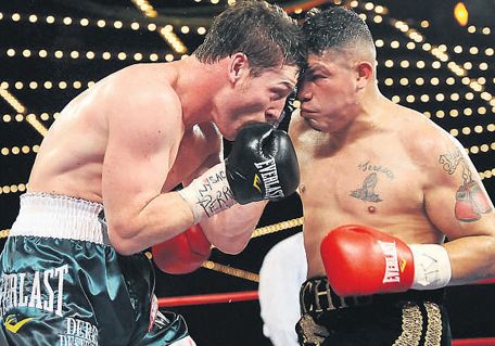John Duddy, left, exchanges punches with Michi Munoz during their fight in New York