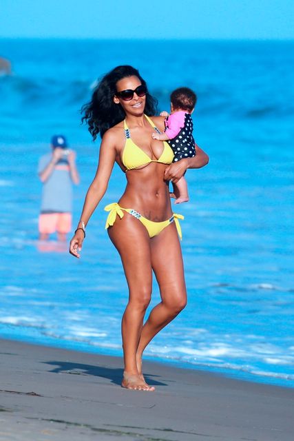 Samantha Mumba on the beach in Miami with baby Sage. Picture: Fame Flynet