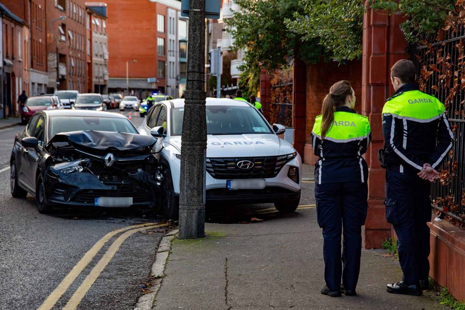 Gardai at the scene of an incident involving a Garda car in Dublin city centre on Friday. Photo: Damien Storan.