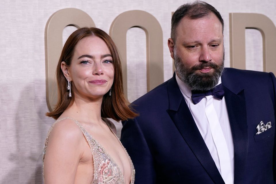 Emma Stone, left, and Yorgos Lanthimos arrive at the 81st Golden Globe Awards on Sunday, Jan. 7, 2024, at the Beverly Hilton in Beverly Hills, Calif. (Photo by Jordan Strauss/Invision/AP)