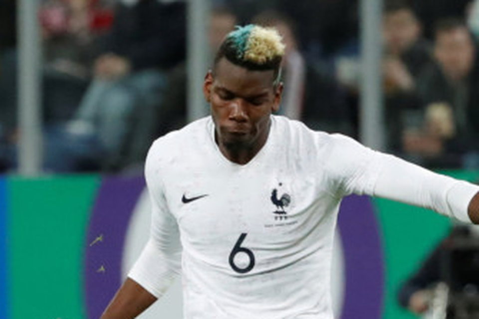 Up and down: Paul Pogba is pictured scoring a free-kick for France in Russia last Tuesday but has struggled for form with Manchester United
