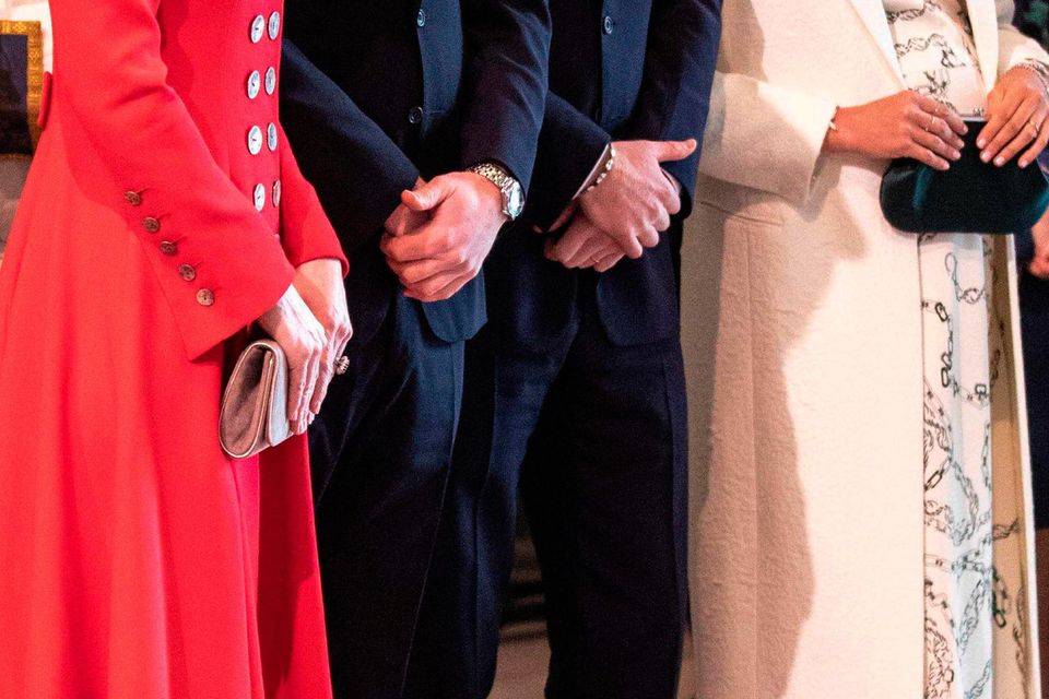 (L-R) Britain's Catherine, Duchess of Cambridge (L), talks with Britain's Meghan, Duchess of Sussex (R) as Britain's Prince William, Duke of Cambridge, and Britain's Prince Harry, Duke of Sussex, stand by attending the Commonwealth Day service at Westminster Abbey in London on March 11, 2019