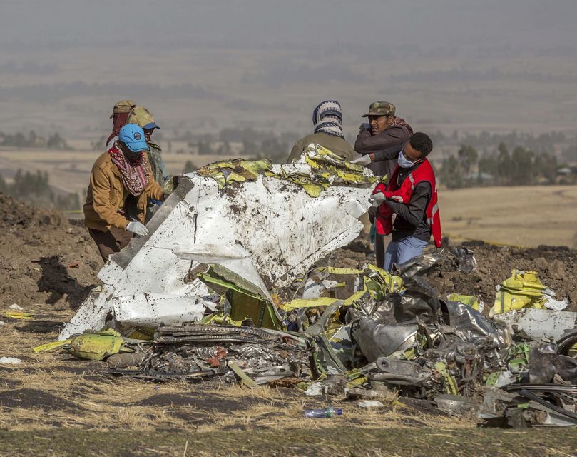 Rescuers at the scene of the crash near Bishoftu, or Debre Zeit, south of Addis Ababa (Mulugeta Ayene/AP)