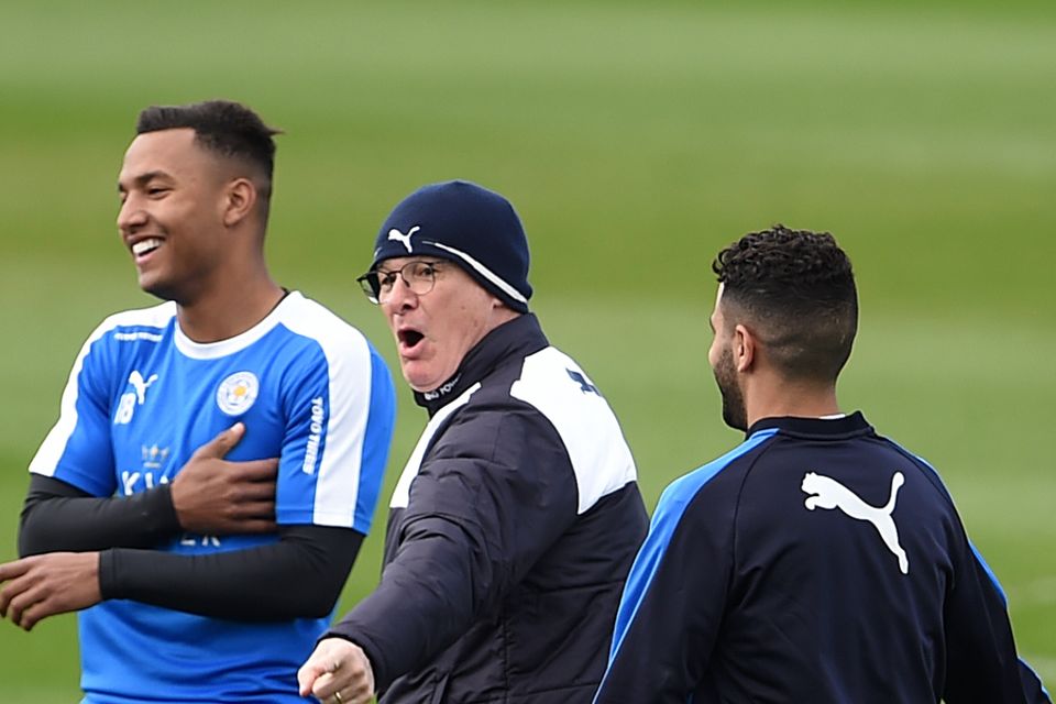 Leicester manager Claudio Ranieri, centre, on the training pitch with his players after winning the Premier League