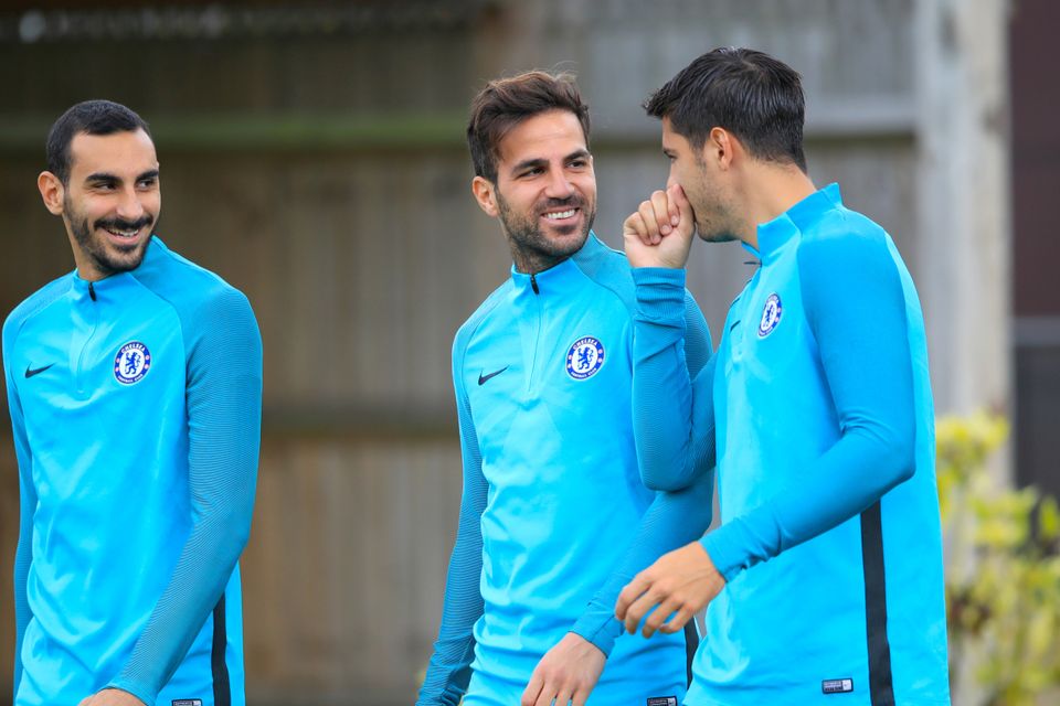 Chelsea midfielder Cesc Fabregas (centre) maintains there are no issues with the training regime of head coach Antonio Conte