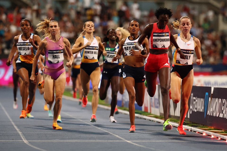 Kenya's Nelly Chepchirchir crosses the line to win the women's 1,500m final ahead of Ireland's Sarah Healy (second) and Ethiopia's Birke Haylom (third). Photo: Gonzalo Fuentes/Reuters