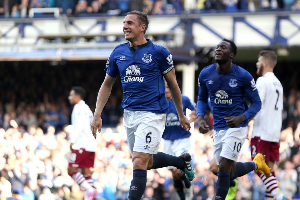 Everton's Phil Jagielka celebrates scoring his side's first goal