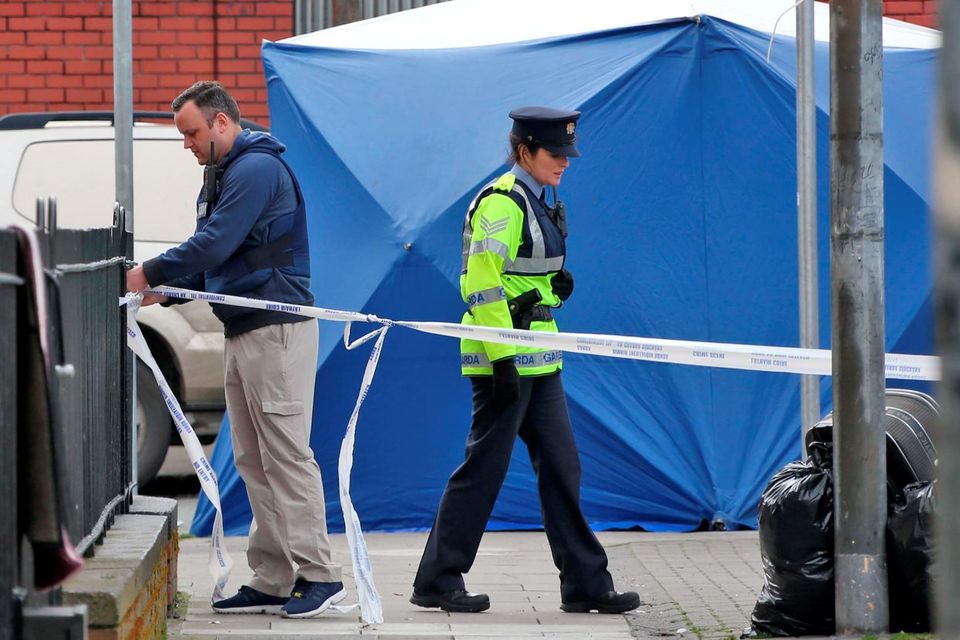 Gardai, detectives and forensic officers at the scene of the fatal shooting on Sheriff Street