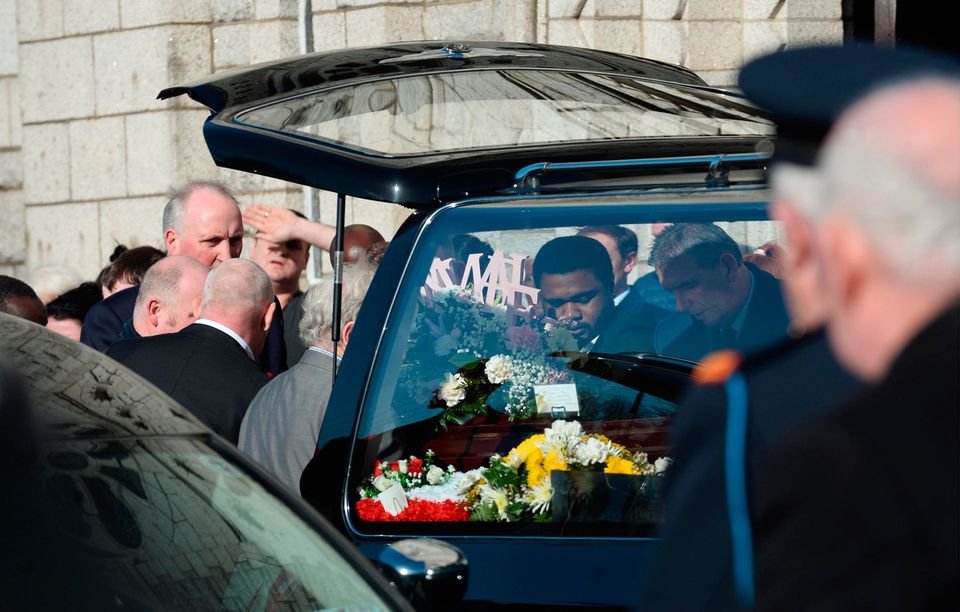 Sean Patel, partner of Annmarie O'Brien, amongst those taking her coffin from hearse to church. Funeral of victims of Clondalkin fire. St. Anne's Church, Shankill, Dublin. Picture: Caroline Quinn